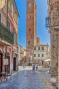 Old medieval tower in a square in Noli, Italy