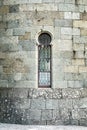 Old medieval window surrounded by stone wall in castle Royalty Free Stock Photo