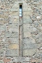 Old medieval window surrounded by stone wall in castle Royalty Free Stock Photo