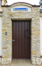 An old medieval wooden door with a studded forged iron frame