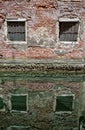 Old medieval worn out brick wall building in Venice, Italy Royalty Free Stock Photo