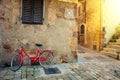 Old Mediterranean town street with red retro bike