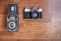 An old medium format twin lens reflex camera and an old 35mm reflex camera, with copy space Royalty Free Stock Photo