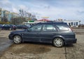 Old dark blue car Toyota Corolla hatchback medium left side view