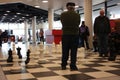 Old men play in public with giant chess