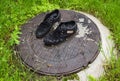 Old men`s shoes. Abandoned on the street after a rain. Worn and Royalty Free Stock Photo