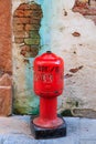 Old messy red fire hydrant