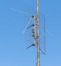 Old metal antenna against a blue sky Royalty Free Stock Photo