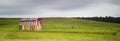 Old Metal Barn in a Field with Motion in Clouds