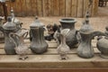 Old metal bedouin coffee pots and jugs for water in one of the m