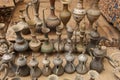 Old metal bedouin coffee pots and jugs for water in one of the m
