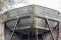 Old metal boat in dry dock for repair