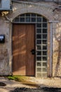 Old metal brown door with window a beautiful vintage background