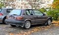 Old metal brown small youngtimer Toyota Corolla compact two door parked