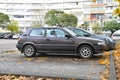 Old metal brown small youngtimer Toyota Corolla compact two door parked