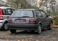 Old metal brown small youngtimer Toyota Corolla compact two door parked