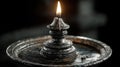 Old metal candle holder with glowing flame Royalty Free Stock Photo