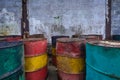 Old metal chemical tanks at sunset sky, dirty oil steel drums, environment, chemical disposal