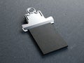 Old metal clip with stack of business cards. 3d rendering