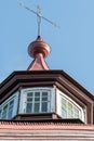 An old metal cross on the dome of a Christian church. An old wooden church. Celebration of Christian holidays baptism and Royalty Free Stock Photo