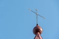 An old metal cross on the dome of a Christian church. An old wooden church. Celebration of Christian holidays baptism and Royalty Free Stock Photo