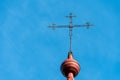 An old metal cross on the dome of a Christian church. An old wooden church. Celebration of Christian holidays baptism and Royalty Free Stock Photo