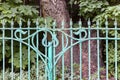 Old metal decorative garden fence painted blue Royalty Free Stock Photo