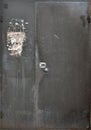 The old metal door is black with two sash. Royalty Free Stock Photo