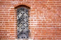 Old metal door in a brick wall on the castle Royalty Free Stock Photo