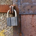 Old metal door closed with a lock Royalty Free Stock Photo