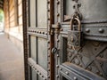 Old metal door with closed padlock, close-up Royalty Free Stock Photo