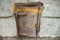 Old metal door in a concrete wall