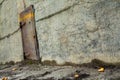 Old metal door in a concrete wall