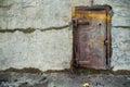 Old metal door in a concrete wall