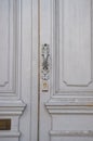 Old metal door handle lock on white wooden door. Door knob Royalty Free Stock Photo