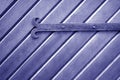 Old metal door hinge on wooden door in blue tone Royalty Free Stock Photo