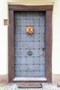 Old metal door with vintage handle and decorations Royalty Free Stock Photo