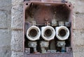 An old metal electrical fuse box serving as the main distribution center and primary safety for the electrical system Royalty Free Stock Photo