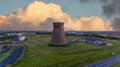 Old metal factory chimney in Caen - Colombelles, Normandy, drone photo at sunset, industrial area