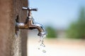 Water Conservation: Faucet and Water Drops in a Public Park Amidst Climate Change
