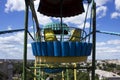 An old metal ferris wheel without people. Carousel, swings, amusement park