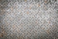 Old metal floor plate with diamond pattern and rusty background Royalty Free Stock Photo