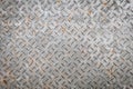 Old metal floor plate with diamond pattern and rusty background Royalty Free Stock Photo