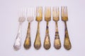 Old metal forks isolated on a white background.