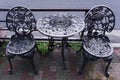 Old metal furniture. Two chairs and a table on the street