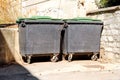 Old metal garbage containers on the street