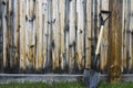 Old Metal Garden Shovel Leaning on Weathered Wooden Fence