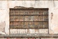 Old metal glass squared industrial window, blacked with red bricks from inside. Royalty Free Stock Photo