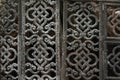 An old metal grille. Composed of patterned openwork plates with oriental ornament Royalty Free Stock Photo