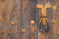 An old metal handle on a wooden door Royalty Free Stock Photo